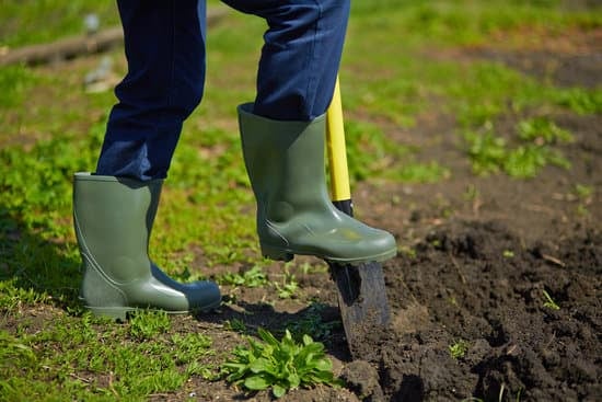 digging out grass with a shovel