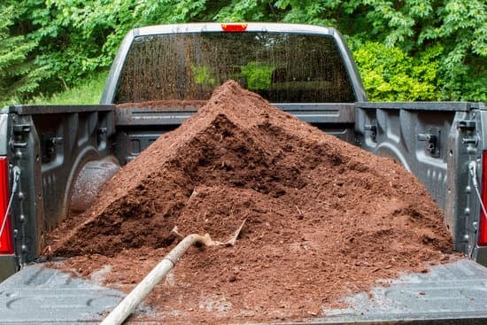 Truck load of mulch with a shovel