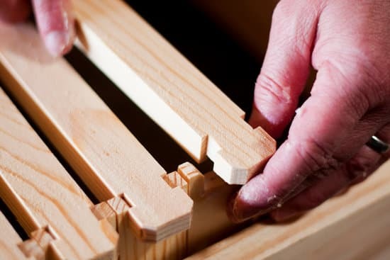 adding wood slats to a top bar hive