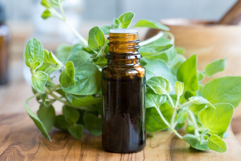 Oregano-essential-oil-with-oregano-in-background