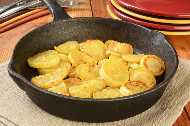 Sauteed summer squash in a cast iron skillet