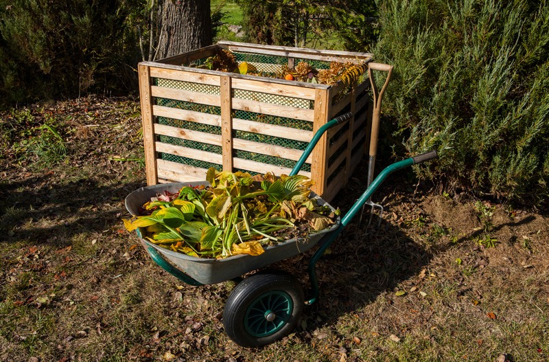 a wheel barrow full of compost materials