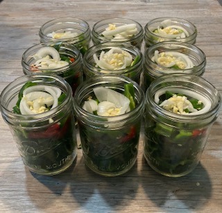 peppers packed into jars