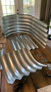 pieces of the raised garden bed ready to assemble